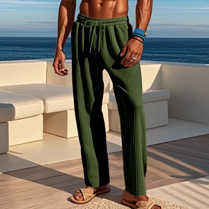 Detail of men's olive green ribbed pants featuring an adjustable drawstring elastic waist