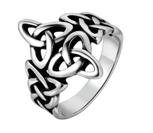 Close-up of vintage silver stainless steel ring with intricate Celtic knot cutout design