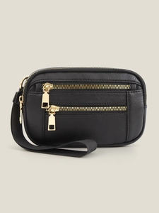 Close-up of black lychee-textured PU leather bag with three golden hardware zippers