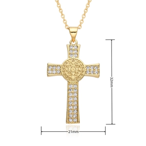 Macro view of gold cross pendant with clear cubic zirconia stones and 32mm size detail