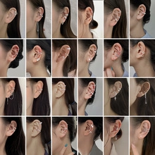 Collage showcasing twenty-four diverse styles of cubic zirconia ear cuffs and clip-on earrings