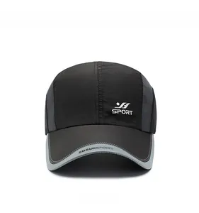 Detail of breathable grey mesh fabric and sports logo on a black quick-dry baseball cap