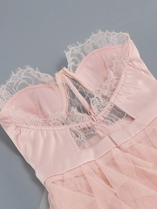 Detail of light pink lace and mesh dress with smooth satin fabric and invisible back zipper