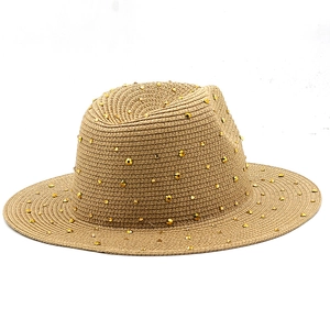 Detailed texture of khaki straw fedora hat featuring decorative gold metal rivets