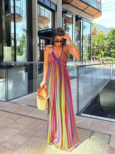 Sleeveless deep V-neck rainbow striped maxi dress with flowy bohemian style silhouette