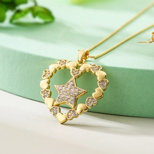 Gold plated heart and star pendant necklace with shimmering cubic zirconia crystals