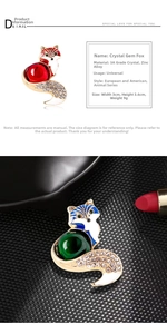 Detail shot of the vintage glass fox brooch with rhinestone inlay on a textured background
