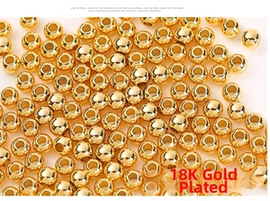 Close-up of polished 18K gold plated solid copper beads for DIY jewelry making