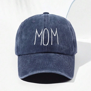 Close-up of MOM white embroidery on vintage washed navy blue cotton baseball cap