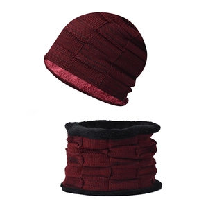 Detail of burgundy knitted beanie and neck gaiter set with warm thick fleece lining