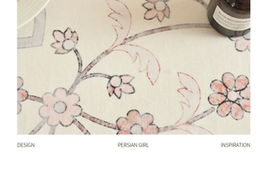 Detail shot of vintage floral Persian rug texture with soft cream and orange patterns