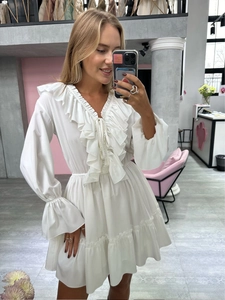 Detail of white V-neck chiffon mini dress with ruffles and elasticated waist detail