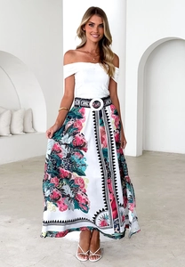 Close-up of high-waist floral maxi skirt with decorative buckle belt and large flower prints