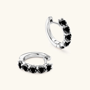 Detailed view of S925 sterling silver hoop earrings with five round black gemstones