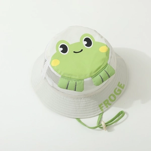 Detail of white mesh bucket hat featuring cartoon frog pattern and adjustable green chin strap