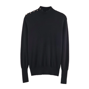 Women's black mock neck knit sweater with decorative gold buttons on the shoulder