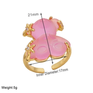 Detail of pink resin bear ring with golden stars showing height and inner diameter