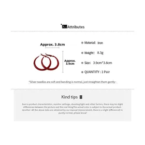 Detail showing red hoop earrings dimensions of 3.9cm by 3.8cm with silver needles