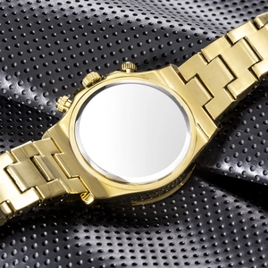 Macro view of gold stainless steel watch back case and luxury link bracelet on leather