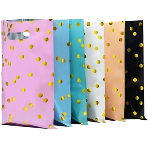 Bulk colorful plastic birthday gift bags with gold polka dots and die-cut handles