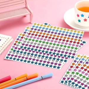 Rainbow glitter star stickers for kids rewards and DIY scrapbooking on pink background
