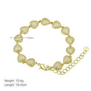 Detail of gold-plated heart bracelet with cubic zirconia, showing 18+5cm length specs