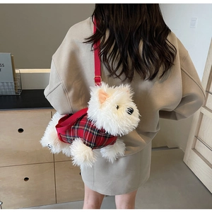 Cute white plush puppy shoulder bag with red plaid outfit worn by a model in a room
