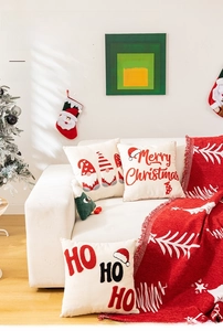 Close-up of festive Christmas pillowcase featuring detailed towel embroidery patterns
