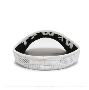 Close-up of white knit sun visor featuring breathable mesh and branded inner strap