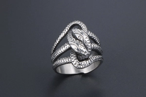 Detailed view of punk style double snake head wrap ring with vintage scale textures