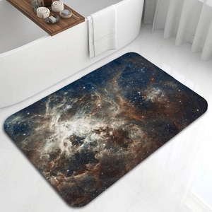 Detailed close-up of a starry nebula diatomite bath mat on a white marble floor