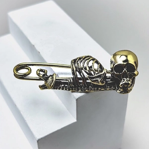 Punk style vintage gold skull safety pin brooch in gothic bone ribcage design