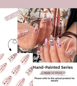 Detail of hand-painted stiletto press-on nails JP1860 with eye and flame patterns