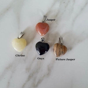 Mixed heart stone pendants in Jasper, Citrine, Onyx and Picture Jasper on marble
