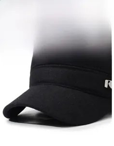 Detail of the firm brim and metal sport logo on this black winter thermal cap for men
