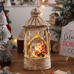 Macro shot of a vintage beige Christmas snow globe lantern with Santa Claus and warm lighting