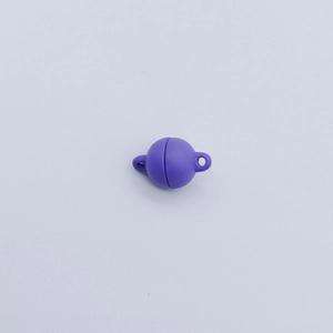 Detail of purple spherical magnetic clasp with metal loops for DIY jewelry making