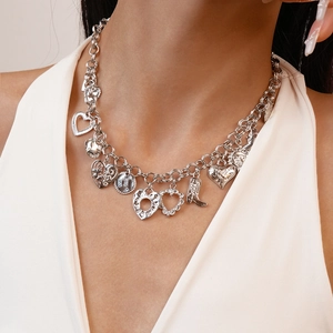 Silver geometric necklace with heart and boot charms on thick metal chain for women