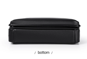 Detailed bottom view of large black lychee grain leather messenger bag with stitching