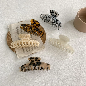 Set of five elegant French acetate hair claws in various marble and tortoiseshell patterns