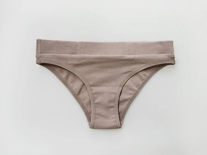 Close-up of low-waisted ribbed cotton underwear in soft morandi brown color