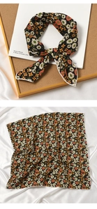 Detail of floral daisy print silk scarf tied in a knot and flat layout presentation