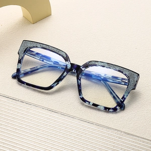 Blue cat-eye blue light blocking glasses with silver glitter insets and vintage frame