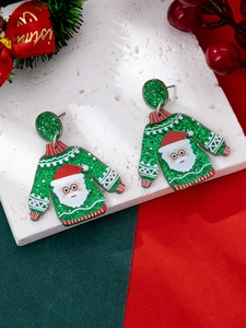 Detail of green glitter Christmas sweater earrings with Santa Claus pattern and sparkles
