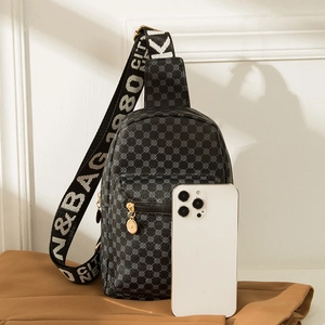 Black crocodile pattern crossbody chest bag with geometric circles and wide logo strap