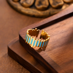 18k gold-plated titanium steel ring with blue enamel and gear-shaped stripe design