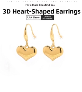 Detailed macro view of 3D gold heart earrings featuring sparkling AAA zircon settings