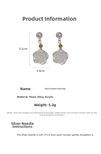 Detailed view of pearl flower earrings showing 3.1cm length and 1.4cm width dimensions