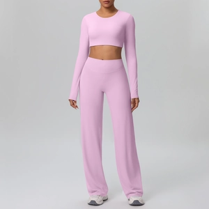 Detail of high-waist wide-leg pants and cropped long-sleeve top in pink yoga set