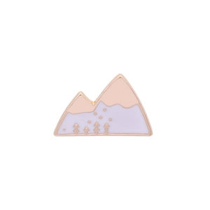 Close-up of a house-shaped enamel brooch with pink and white mountain scenery details